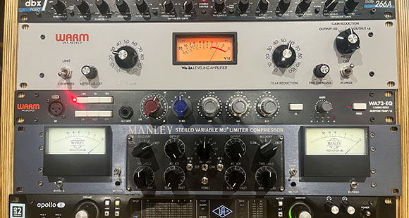 a mixing board with many different dials and knobs