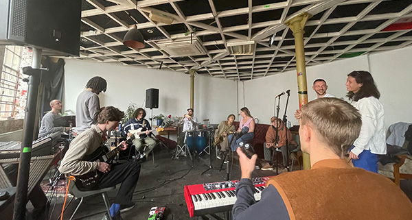 a group of people in a jam session together