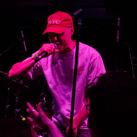 a person performing music in a dark room