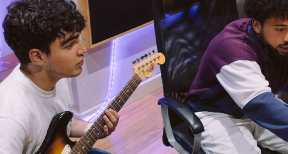 two men recording guitar in Root Seventy Three studios