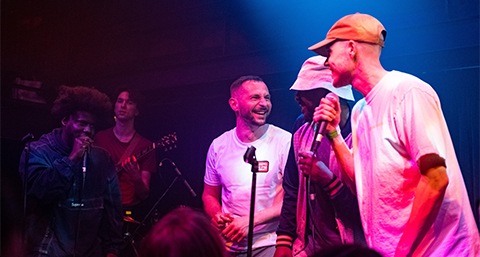 three people performing together at a performance for Root Seventy Three